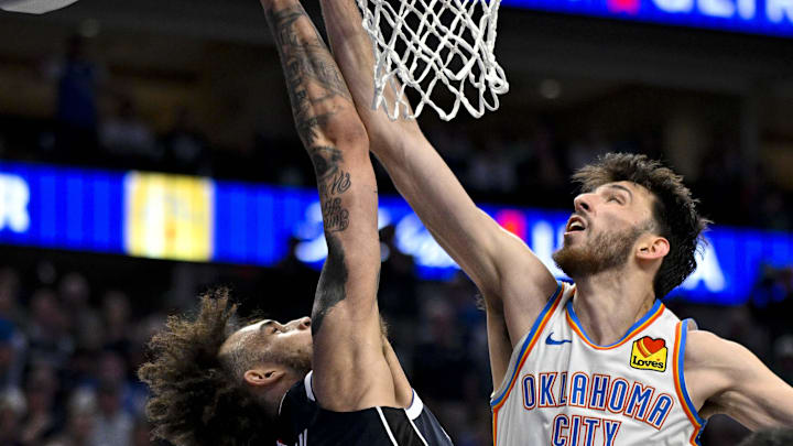 May 13, 2024; Dallas, Texas, USA; Oklahoma City Thunder forward Chet Holmgren (7) blocks a shot by Dallas Mavericks center Dereck Lively II (2) during the second half in game four of the second round for the 2024 NBA playoffs at American Airlines Center. Mandatory Credit: Jerome Miron-Imagn Images