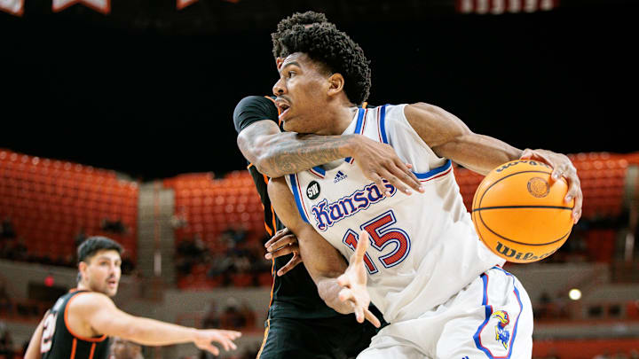 Feb 18, 2026; Stillwater, Oklahoma, USA; Kansas Jayhawks forward Bryson Tiller (15) drives to the basket during the second half against the Oklahoma State Cowboys at Gallagher-Iba Arena. Mandatory Credit: William Purnell-Imagn Images