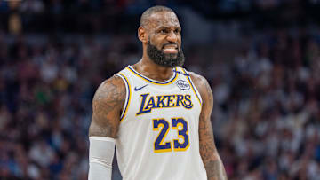 Apr 27, 2025; Minneapolis, Minnesota, USA; Los Angeles Lakers forward LeBron James (23) talks with a referee in the third quarter against the Minnesota Timberwolves during game four of first round for the 2025 NBA Playoffs at Target Center. Mandatory Credit: Matt Blewett-Imagn Images