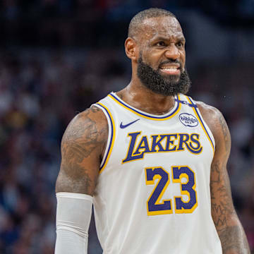 Apr 27, 2025; Minneapolis, Minnesota, USA; Los Angeles Lakers forward LeBron James (23) talks with a referee in the third quarter against the Minnesota Timberwolves during game four of first round for the 2025 NBA Playoffs at Target Center. Mandatory Credit: Matt Blewett-Imagn Images