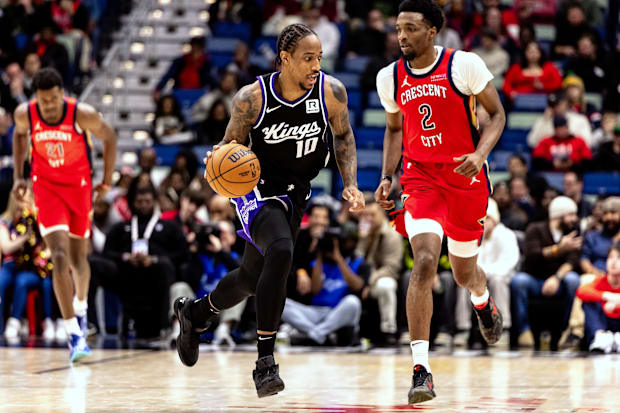 Sacramento Kings forward DeMar DeRozan (10) brings the ball up court against New Orleans Pelicans forward Herbert Jones (2)