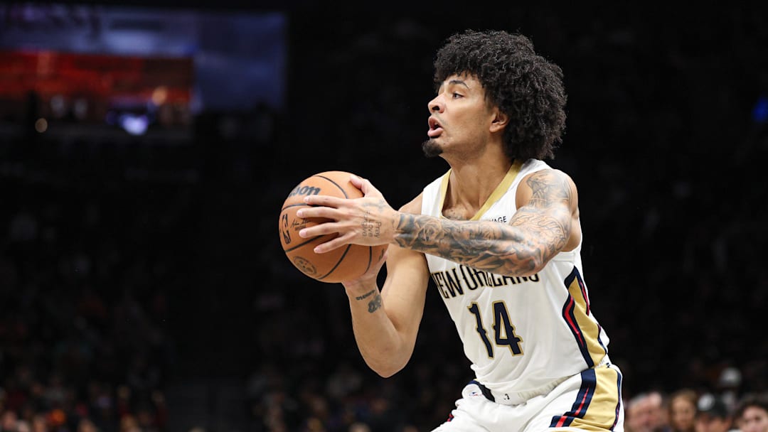 Dec 6, 2025; Brooklyn, New York, USA; New Orleans Pelicans guard Micah Peavy (14) shoots the ball against the Brooklyn Nets during the first half at Barclays Center. Mandatory Credit: Vincent Carchietta-Imagn Images