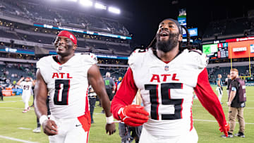 Sep 16, 2024; Philadelphia, Pennsylvania, USA; Atlanta Falcons linebacker Matthew Judon (15) and linebacker Lorenzo Carter (0) celebrate after a victory against the Philadelphia Eagles at Lincoln Financial Field. Mandatory Credit: Bill Streicher-Imagn Images