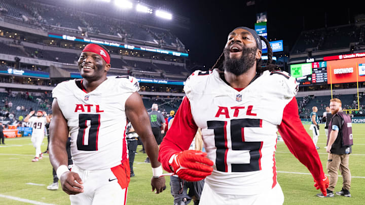 Sep 16, 2024; Philadelphia, Pennsylvania, USA; Atlanta Falcons linebacker Matthew Judon (15) and linebacker Lorenzo Carter (0) celebrate after a victory against the Philadelphia Eagles at Lincoln Financial Field. Mandatory Credit: Bill Streicher-Imagn Images