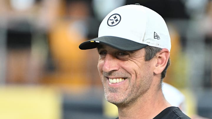 Pittsburgh Steelers quarterback Aaron Rodgers watches introductions during a game against the Tampa Bay Buccaneers. Pittsburgh Steelers quarterback Aaron Rodgers watches introductions during a game against the Tampa Bay Buccaneers.