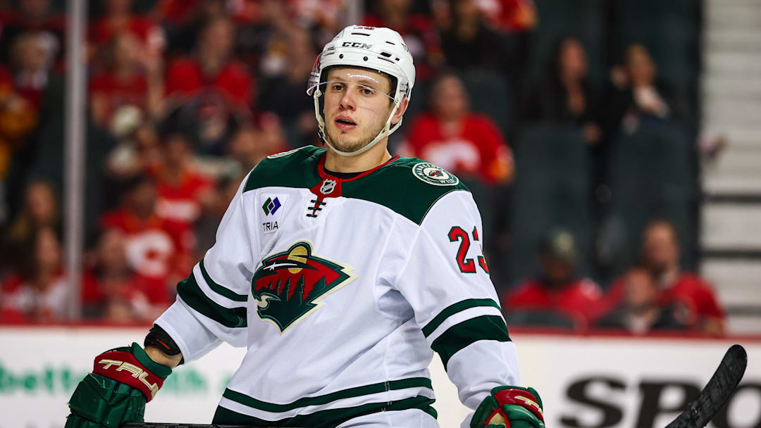 Apr 11, 2025; Calgary, Alberta, CAN; Minnesota Wild center Marco Rossi (23) against the Calgary Flames during the third period at Scotiabank Saddledome. Mandatory Credit: Sergei Belski-Imagn Images