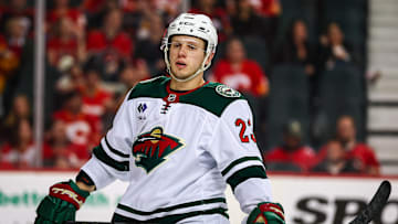 Apr 11, 2025; Calgary, Alberta, CAN; Minnesota Wild center Marco Rossi (23) against the Calgary Flames during the third period at Scotiabank Saddledome. Mandatory Credit: Sergei Belski-Imagn Images