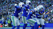 Nov 30, 2025; Seattle, Washington, USA; Seattle Seahawks safety Ty Okada (39) celebrates with his teammates after retrieving a fumble during the second half against the Minnesota Vikings at Lumen Field. Mandatory Credit: Kevin Ng-Imagn Images