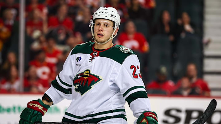 Apr 11, 2025; Calgary, Alberta, CAN; Minnesota Wild center Marco Rossi (23) against the Calgary Flames during the third period at Scotiabank Saddledome. Mandatory Credit: Sergei Belski-Imagn Images