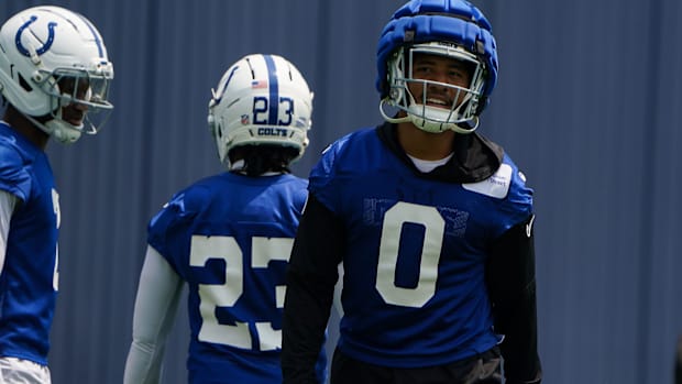 Colts safety Camryn Bynum (blue jersey) runs through drills during an offseason workout.