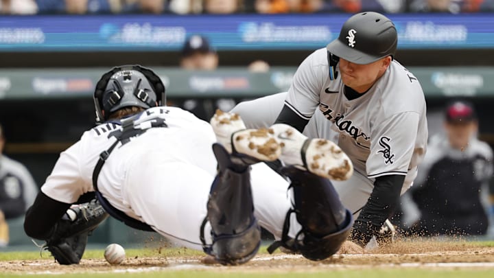 Chicago White Sox catcher Matt Thaiss scores a run ahead of the throw to Detroit Tigers catcher Dillon Dingler. Chicago White Sox catcher Matt Thaiss scores a run ahead of the throw to Detroit Tigers catcher Dillon Dingler.
