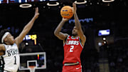 New Mexico Lobos guard Donovan Dent shoots the ball over Michigan State Spartans guard Jeremy Fears Jr. in the second half during the NCAA Tournament Second Round at Rocket Arena. 