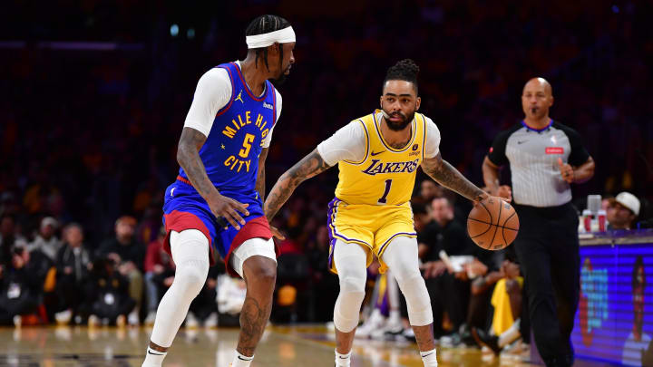 Apr 25, 2024; Los Angeles, California, USA; Los Angeles Lakers guard D'Angelo Russell (1) moves the ball against Denver Nuggets guard Kentavious Caldwell-Pope (5) during the second half in game three of the first round for the 2024 NBA playoffs at Crypto.com Arena. Mandatory Credit: Gary A. Vasquez-USA TODAY Sports