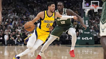 Apr 25, 2025; Milwaukee, Wisconsin, USA; Indiana Pacers guard Tyrese Haliburton (0) drives against Milwaukee Bucks forward Taurean Prince (12) in the first half during game three of first round for the 2024 NBA Playoffs at Fiserv Forum. Mandatory Credit: Michael McLoone-Imagn Images