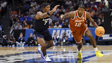 Mar 19, 2025; Dayton, OH, USA; Texas Longhorns guard Tramon Mark (12) dribbles defended by Xavier Musketeers guard Ryan Conwell (7) in the first half at UD Arena.
