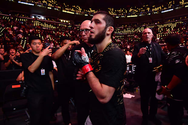 Islam Makhachev (red gloves) leaves the octagon after defeating Renato Moicano (not pictured) in a lightweight title fight.