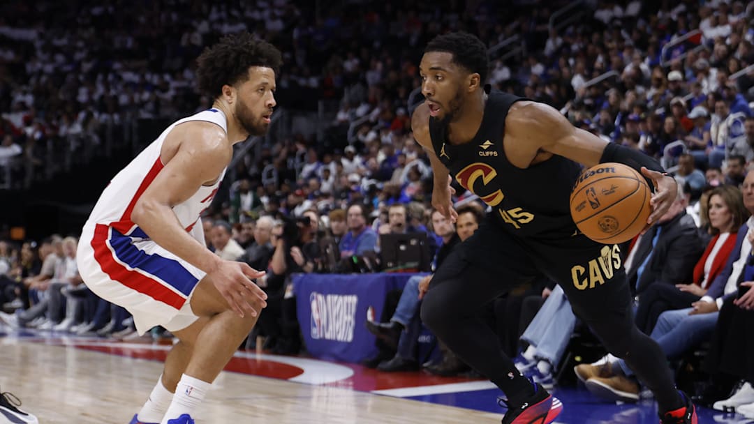 May 5, 2026; Detroit, Michigan, USA; Cleveland Cavaliers guard Donovan Mitchell (45) dribbles defended by Detroit Pistons guard Cade Cunningham (2) in the first half during game one of the second round of the 2026 NBA Playoffs at Little Caesars Arena. Mandatory Credit: Rick Osentoski-Imagn Images