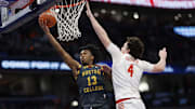 Mar 13, 2024; Washington, D.C., USA;Boston College Eagles guard Donald Hand Jr. (13) shoots the ball as Clemson Tigers forward Ian Schieffelin (4) defends in the first half  at Capital One Arena. Mandatory Credit: Geoff Burke-Imagn Images