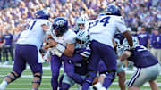 Oct 11, 2025; Manhattan, Kansas, USA; TCU Horned Frogs quarterback Josh Hoover (10) is sacked by Kansas State Wildcats linebacker Desmond Purnell (32) during the third quarter at Bill Snyder Family Football Stadium. Mandatory Credit: Scott Sewell-Imagn Images