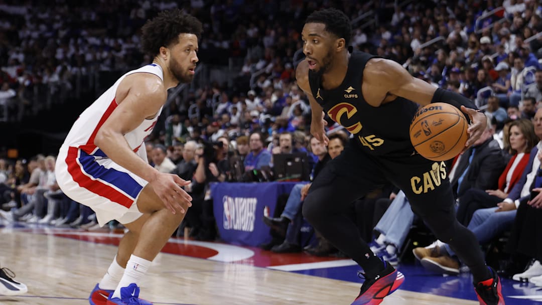 May 5, 2026; Detroit, Michigan, USA; Cleveland Cavaliers guard Donovan Mitchell (45) dribbles defended by Detroit Pistons guard Cade Cunningham (2) in the first half during game one of the second round of the 2026 NBA Playoffs at Little Caesars Arena. Mandatory Credit: Rick Osentoski-Imagn Images