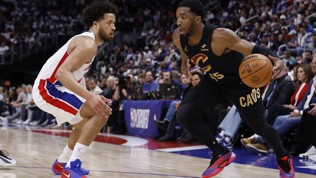 May 5, 2026; Detroit, Michigan, USA; Cleveland Cavaliers guard Donovan Mitchell (45) dribbles defended by Detroit Pistons guard Cade Cunningham (2) in the first half during game one of the second round of the 2026 NBA Playoffs at Little Caesars Arena. Mandatory Credit: Rick Osentoski-Imagn Images