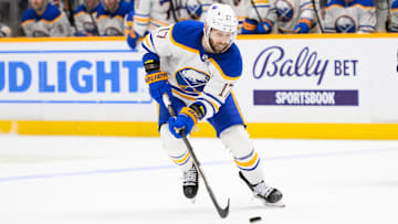 Feb 8, 2025; Nashville, Tennessee, USA;  Buffalo Sabres left wing Jason Zucker (17) skates with the puck against the Nashville Predators during the second period at Bridgestone Arena. Mandatory Credit: Steve Roberts-Imagn Images