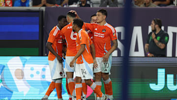  Houston Dynamo forward Ezequiel Ponce (10) celebrates after scoring a goal with midfielder Duane Holmes (14), midfielder Artur (6) during the second half against the San Diego FC 