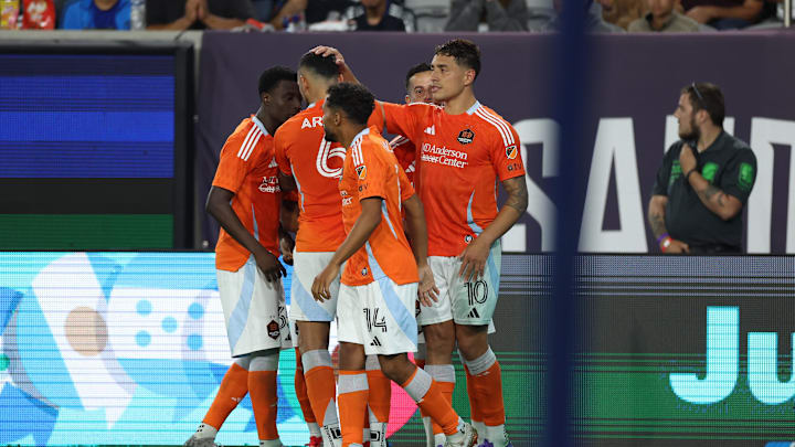  Houston Dynamo forward Ezequiel Ponce (10) celebrates after scoring a goal with midfielder Duane Holmes (14), midfielder Artur (6) during the second half against the San Diego FC 