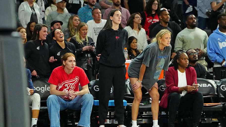 Fever forward Chloe Bibby (55), Indiana Fever guard Caitlin Clark (22), and Indiana Fever guard Sophie Cunningham