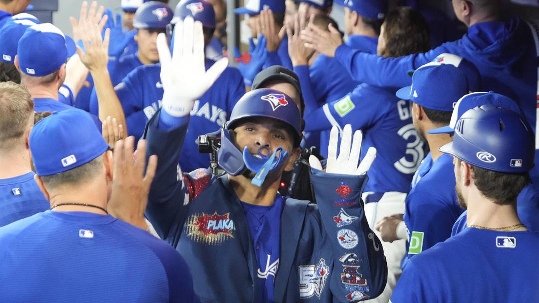 May 11, 2026; Toronto, Ontario, CAN; Toronto Blue Jays shortstop Andres Gimenez (0) gets congratulated after hitting his first home run of the game against the Tampa  Bay Rays in the second inning at Rogers Centre. Mandatory Credit: John E. Sokolowski-Imagn Images