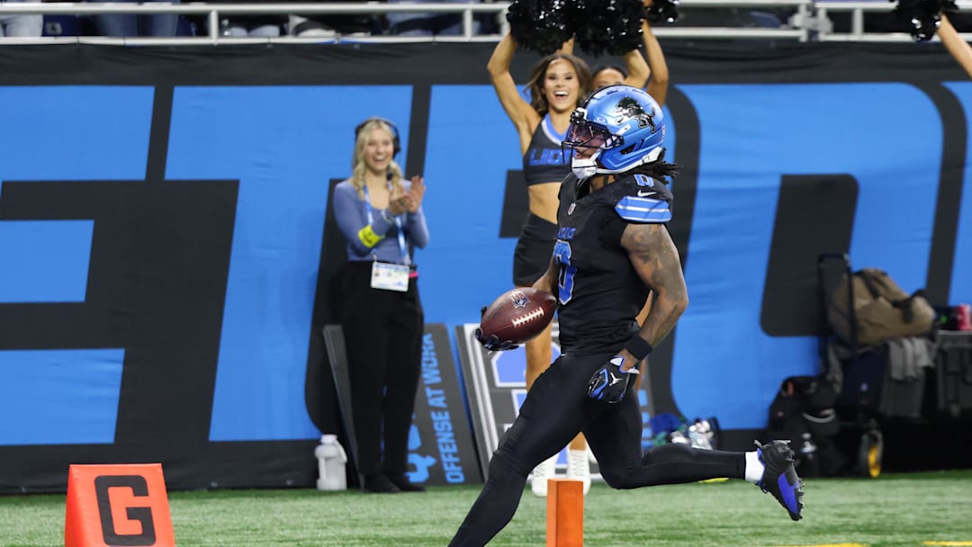 Nov 23, 2025; Detroit, Michigan, USA; Detroit Lions running back Jahmyr Gibbs (0) runs the ball for a touchdown in overtime against the New York Giants at Ford Field.  