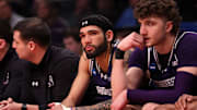 Mar 24, 2024; Brooklyn, NY, USA; Northwestern Wildcats guard Boo Buie (0) reacts on the bench against the Connecticut Huskies in the second round of the 2024 NCAA Tournament at the Barclays Center. Mandatory Credit: Brad Penner-Imagn Images