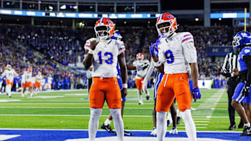Nov 8, 2025; Lexington, Kentucky, USA; Florida Gators running back Jadan Baugh (13) celebrates with wide receiver J. Michael Sturdivant (9) after scoring a touchdown during the first quarter against the Kentucky Wildcats at Kroger Field. Mandatory Credit: Jordan Prather-Imagn Images