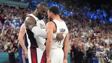 Aug 8, 2024; Paris, France; United States guard LeBron James (6) and shooting guard Stephen Curry (4) celebrate after the game against Serbia  in a men's basketball semifinal game during the Paris 2024 Olympic Summer Games at Accor Arena. Mandatory Credit: Rob Schumacher-USA TODAY Sports