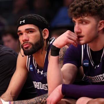Mar 24, 2024; Brooklyn, NY, USA; Northwestern Wildcats guard Boo Buie (0) reacts on the bench against the Connecticut Huskies in the second round of the 2024 NCAA Tournament at the Barclays Center. Mandatory Credit: Brad Penner-Imagn Images
