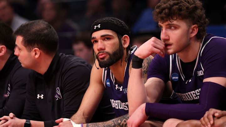 Mar 24, 2024; Brooklyn, NY, USA; Northwestern Wildcats guard Boo Buie (0) reacts on the bench against the Connecticut Huskies in the second round of the 2024 NCAA Tournament at the Barclays Center. Mandatory Credit: Brad Penner-Imagn Images