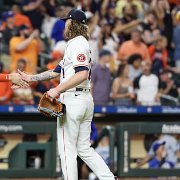 Aug 29, 2024; Houston, Texas, USA;  Houston Astros catcher Yainer Diaz (21) shakes hands with  relief pitcher Josh Hader (71) after defeating the Kansas City Royals at Minute Maid Park. 