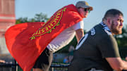 Justin Hart of Morton, a member of The 309 soccer fan club, sports a Manchester United F.C. flag 