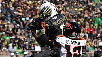 Sep 20, 2025; Eugene, Oregon, USA; Oregon Ducks wide receiver Jeremiah McClellan (11) makes a reception for a touchdown defended by Oregon State Beavers defensive back Trey Glasper (19) during the third quarter of the game at Autzen Stadium. Mandatory Credit: Troy Wayrynen-Imagn Images