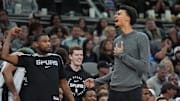 Mar 4, 2025; San Antonio, Texas, USA;  San Antonio Spurs guard Blake Wesley (14) and San Antonio Spurs center Victor Wembanyama (1) celebrate on the sideline in the second half against the Brooklyn Nets at Frost Bank Center. Mandatory Credit: Daniel Dunn-Imagn Images