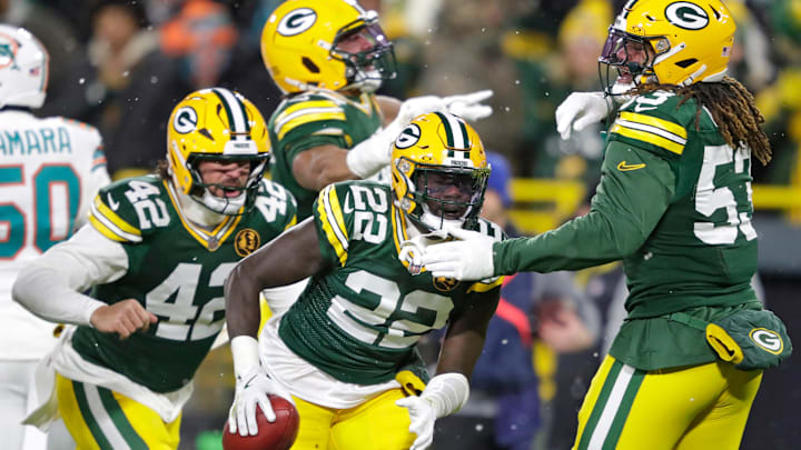 Green Bay Packers cornerback Robert Rochell (22) celebrates recovering a fumble on a punt return against the Miami Dolphins, at Lambeau Field in Green Bay, Wisconsin.