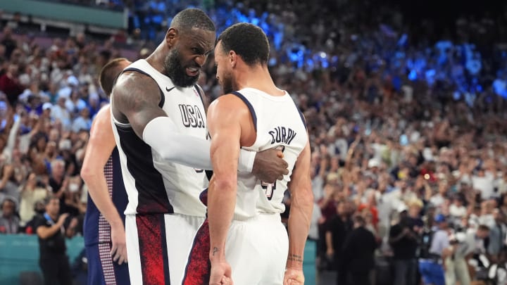 Aug 8, 2024; Paris, France; United States forward LeBron James (6) and point guard Stephen Curry (4) celebrate after the game against Serbia  in a men's basketball semifinal game during the Paris 2024 Olympic Summer Games at Accor Arena. Mandatory Credit: Rob Schumacher-USA TODAY Sports