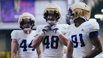Hayden Moore, Jacob Lane and Isaiah Ward each are edge-rusher candidates for the Huskies. 