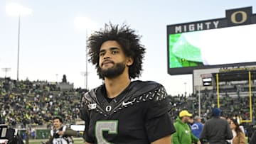 Nov 22, 2025; Eugene, Oregon, USA; Oregon Ducks quarterback Dante Moore (5) walks off the field after the game against the Southern California Trojans at Autzen Stadium. 