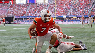 Sep 4, 2021; Atlanta, Georgia, USA; Miami Hurricanes wide receiver Xavier Restrepo (7) reacts after scoring a touchdown during the third quarter against the Alabama Crimson Tide at Mercedes-Benz Stadium. Mandatory Credit: Jason Getz-USA TODAY Sports