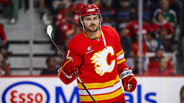 Apr 11, 2025; Calgary, Alberta, CAN; Calgary Flames defenseman Rasmus Andersson (4) against the Minnesota Wild during the third period at Scotiabank Saddledome. Mandatory Credit: Sergei Belski-Imagn Images