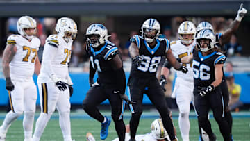Nov 9, 2025; Charlotte, North Carolina, USA; Carolina Panthers linebacker Nic Scourton (11) celebrates a sack during the fourth quarter against the New Orleans Saints at Bank of America Stadium. Mandatory Credit: Jim Dedmon-Imagn Images