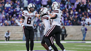 Nov 1, 2025; Manhattan, Kansas, USA; Texas Tech Red Raiders linebacker John Curry (6) celebrates with defensive backs Cole Wisniewski (5) and Brice Pollock (14) after a fourth-down defensive stop against the Kansas State Wildcats in the fourth quarter at Bill Snyder Family Football Stadium. Mandatory Credit: Scott Sewell-Imagn Images