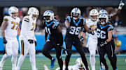 Nov 9, 2025; Charlotte, North Carolina, USA; Carolina Panthers linebacker Nic Scourton (11) celebrates a sack during the fourth quarter against the New Orleans Saints at Bank of America Stadium. Mandatory Credit: Jim Dedmon-Imagn Images