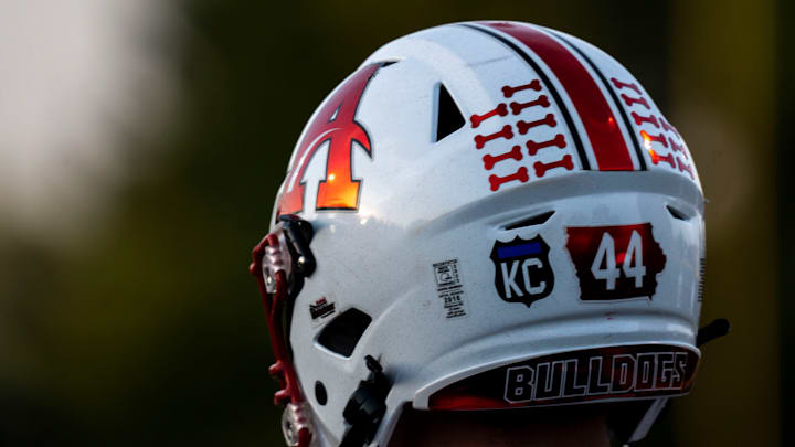 Algona's Reid Louwagie wears a helmet decal commemorating the death of Algona Officer Kevin Cram during a football game at Lions Field on Friday, September 29, 2023 in Clear Lake. Algona's Reid Louwagie wears a helmet decal commemorating the death of Algona Officer Kevin Cram during a football game at Lions Field on Friday, September 29, 2023 in Clear Lake.